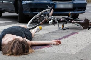 woman on bike hit by car