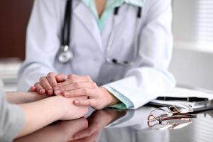 doctor comforting patient