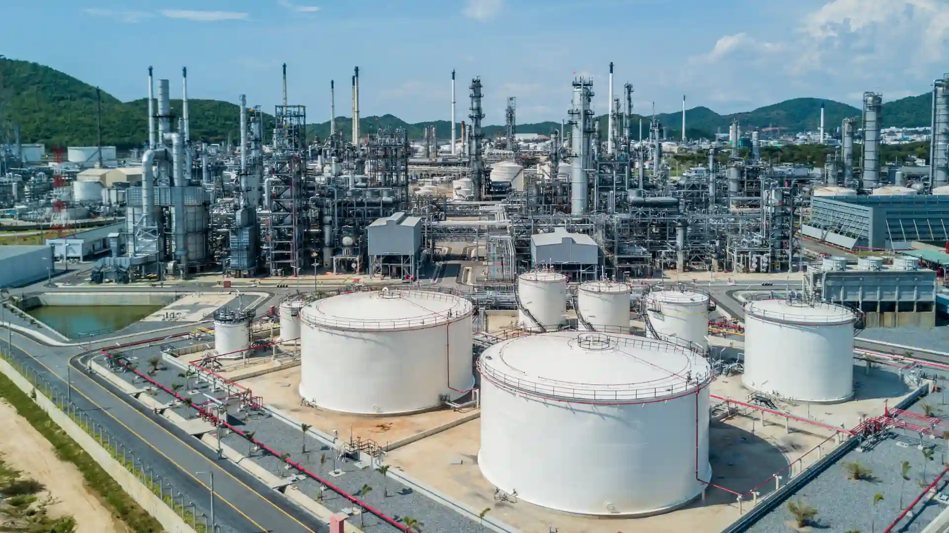 Oil refinery with white storage tanks